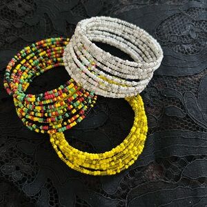 Set of three African beaded bracelets yellow white